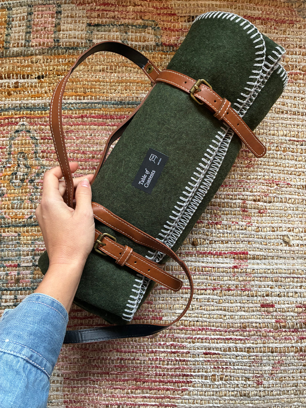 Wall blanket with leather strap