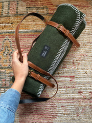 Wall blanket with leather strap